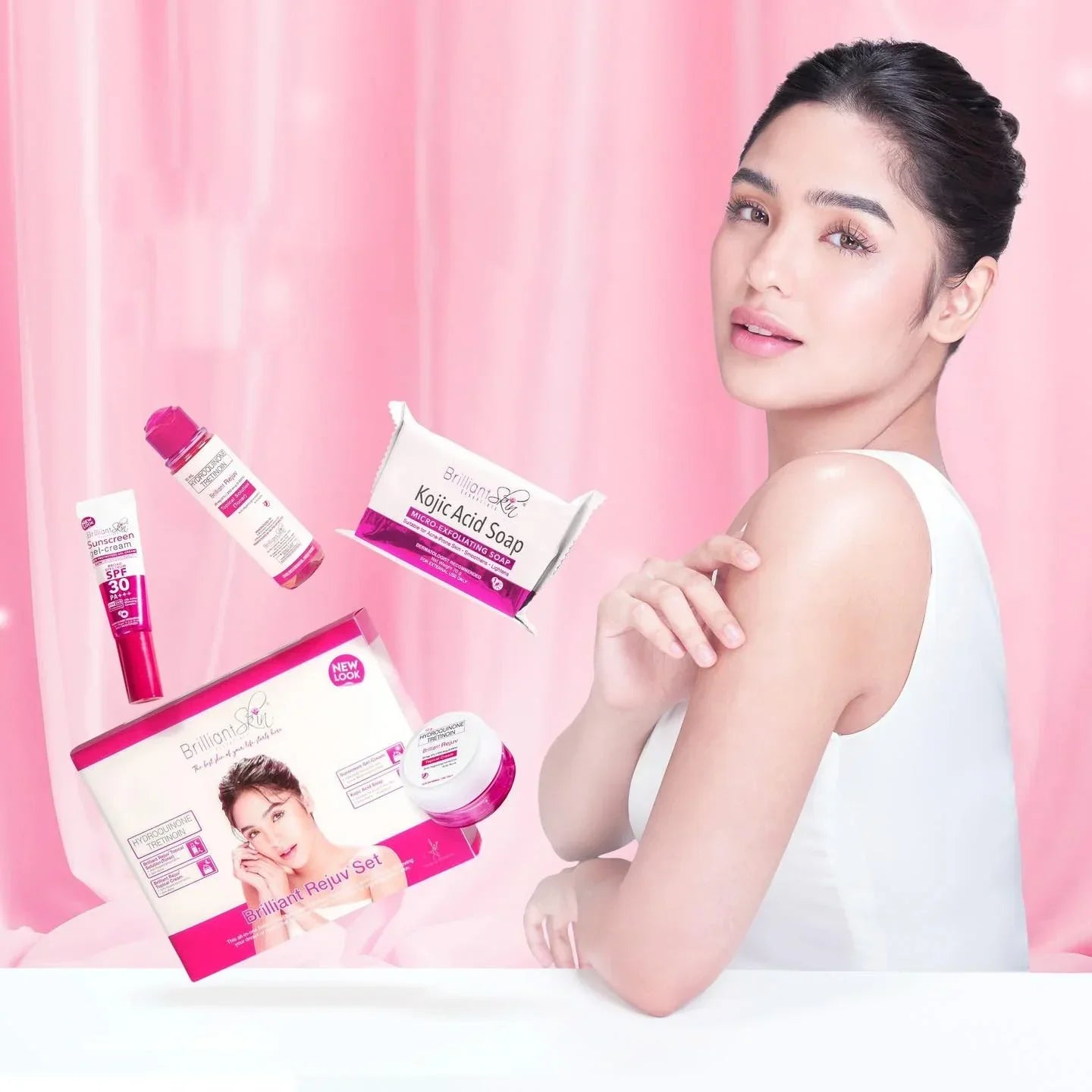 Before and after results using the Brilliant Skin Essentials Rejuvenating Set to clear dark spots, featuring the full 4-piece facial kit items.