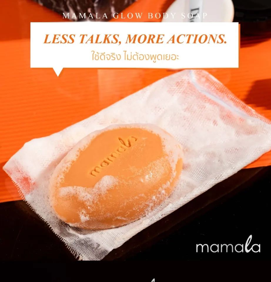 Wrapped Mamala Glow Body Soap bar on an orange and black background featuring the slogan Less Talks, More Actions.