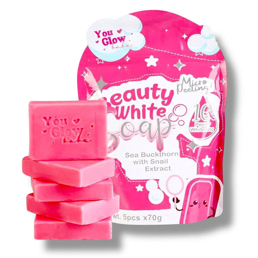 Stacked pink You Glow Babe Beauty White soap bars with the matching hot pink product pouch on a clean white background.